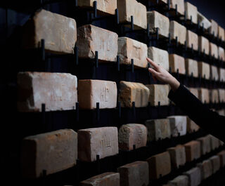 "У каждого из них своя судьба". В Омске открылась кирпичная выставка